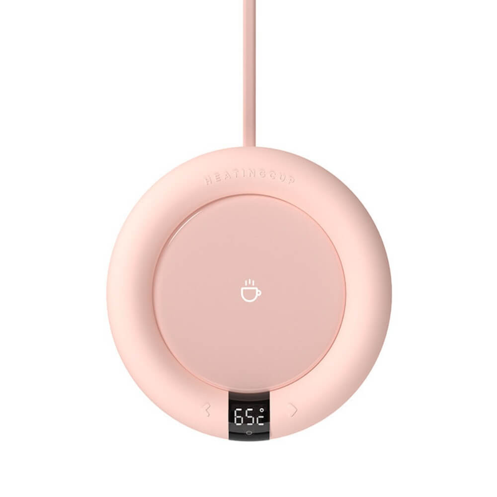 The pink mug warmer, set at 65 degrees Celsius. Its USB cord attached.